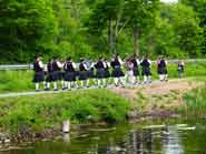 Photo of bag-pipe band on towpath